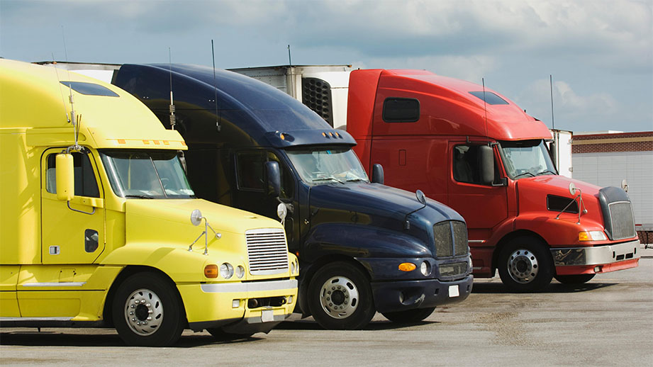 A trailer truck dealership showing trucks on display.